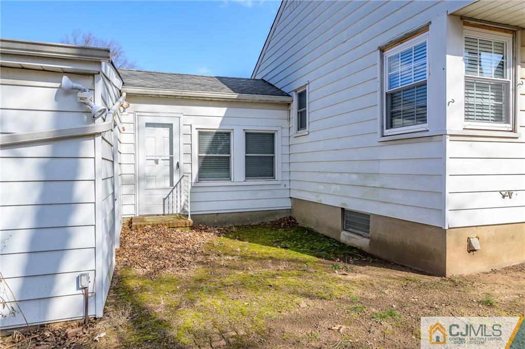 14 Sine Road Edison, NJ 08817 - Photo 30 of 33 a view of a house with a wooden door
