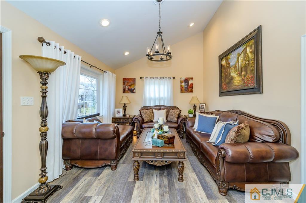 14 Sine Road Edison, NJ 08817 - Photo 5 of 33 a living room with furniture a ceiling fan and a window