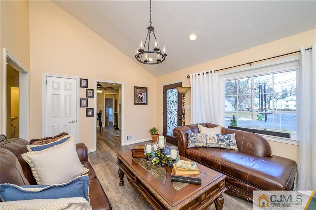 14 Sine Road Edison, NJ 08817 - Photo 8 of 33 a living room with furniture ceiling fan and a window