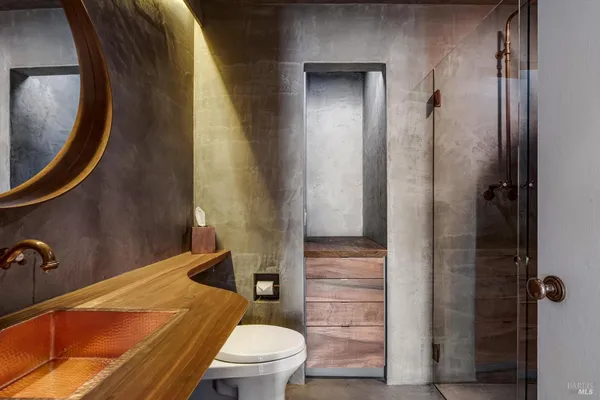 a kitchen with granite countertop a sink and a stove top oven
