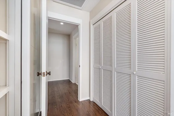 a view of livingroom with furniture wooden floor and front door