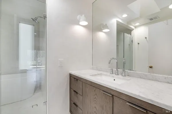 a backyard of a house with a large tree