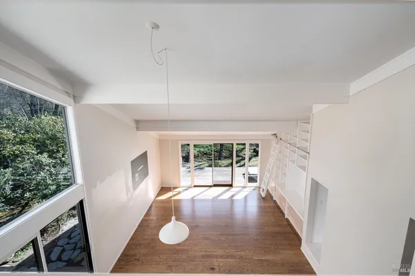 a view of a house with swimming pool and sitting area