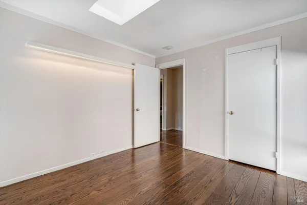 a view of a backyard with wooden fence
