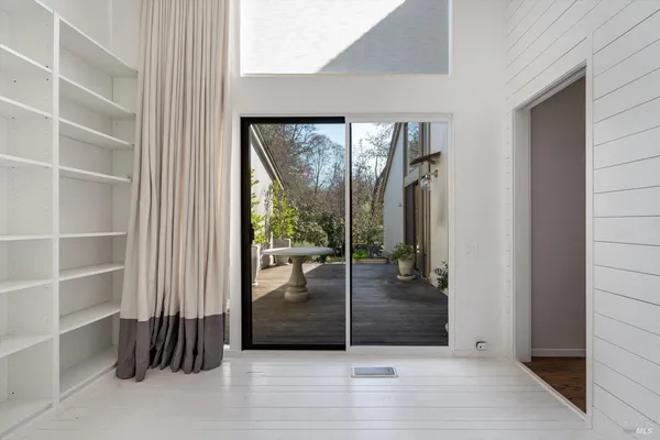 a view of a lake with a table and chairs