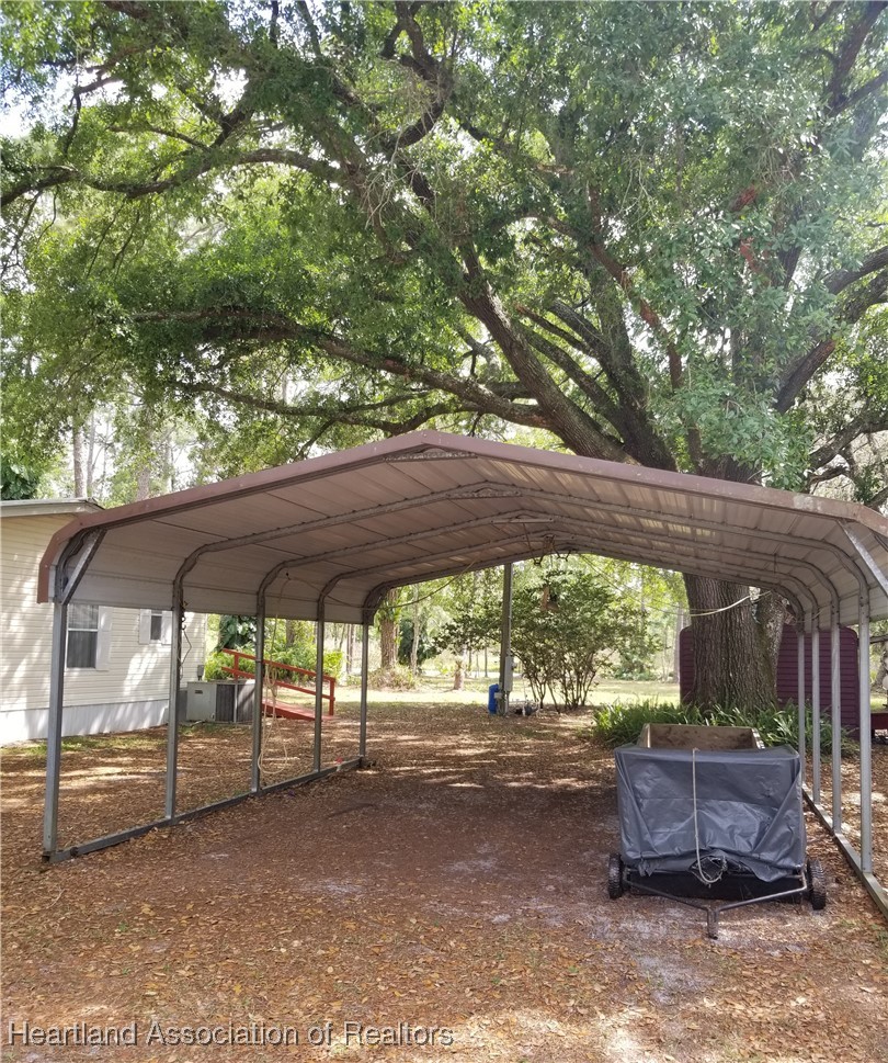 9125 Spur Path Sebring, FL 33875 - Photo 22 of 31 2-car carport with dirt flooor