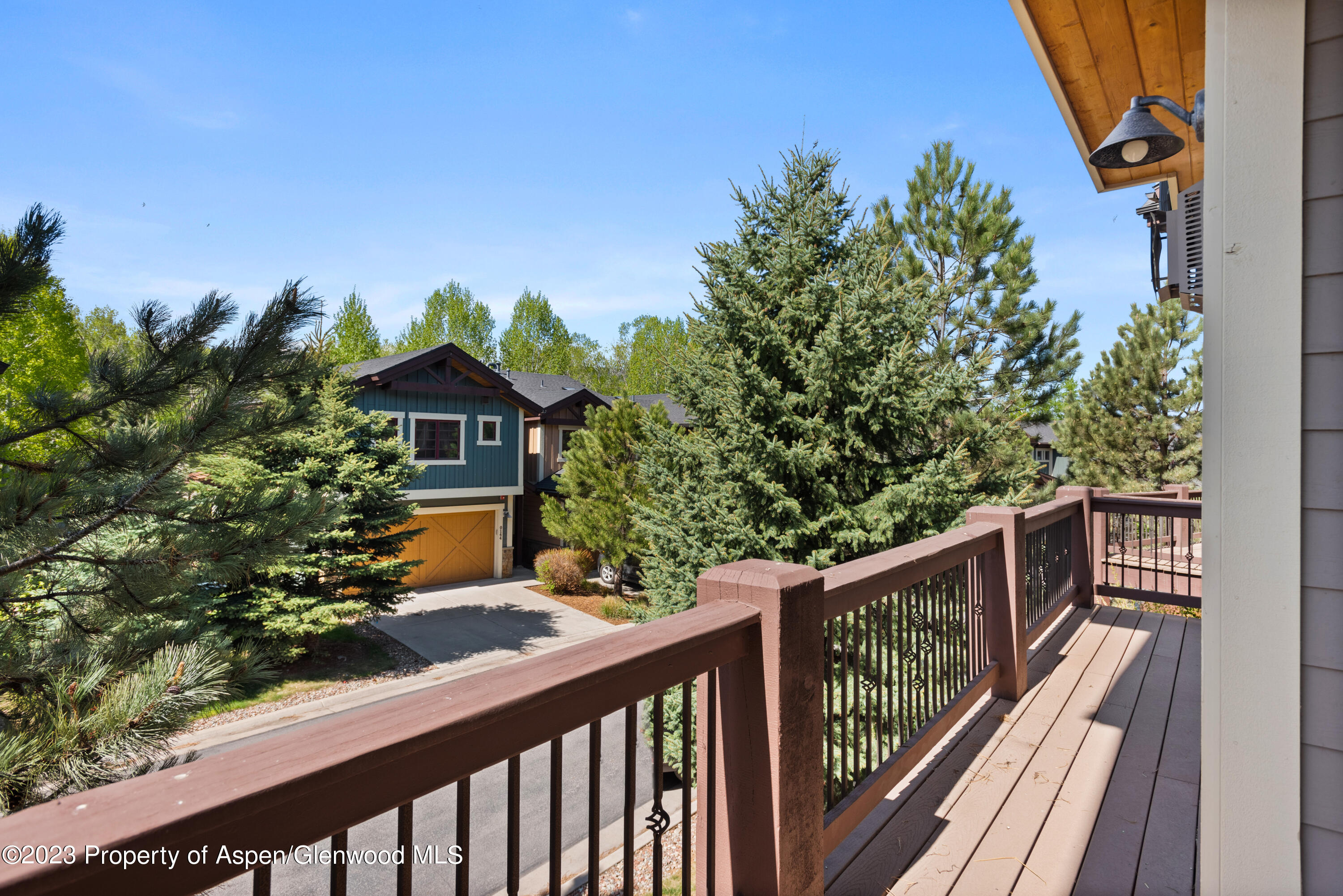 141 Juniper Trail Carbondale, CO 81623 - Photo 16 of 21 a balcony with wooden floor and trees in the back