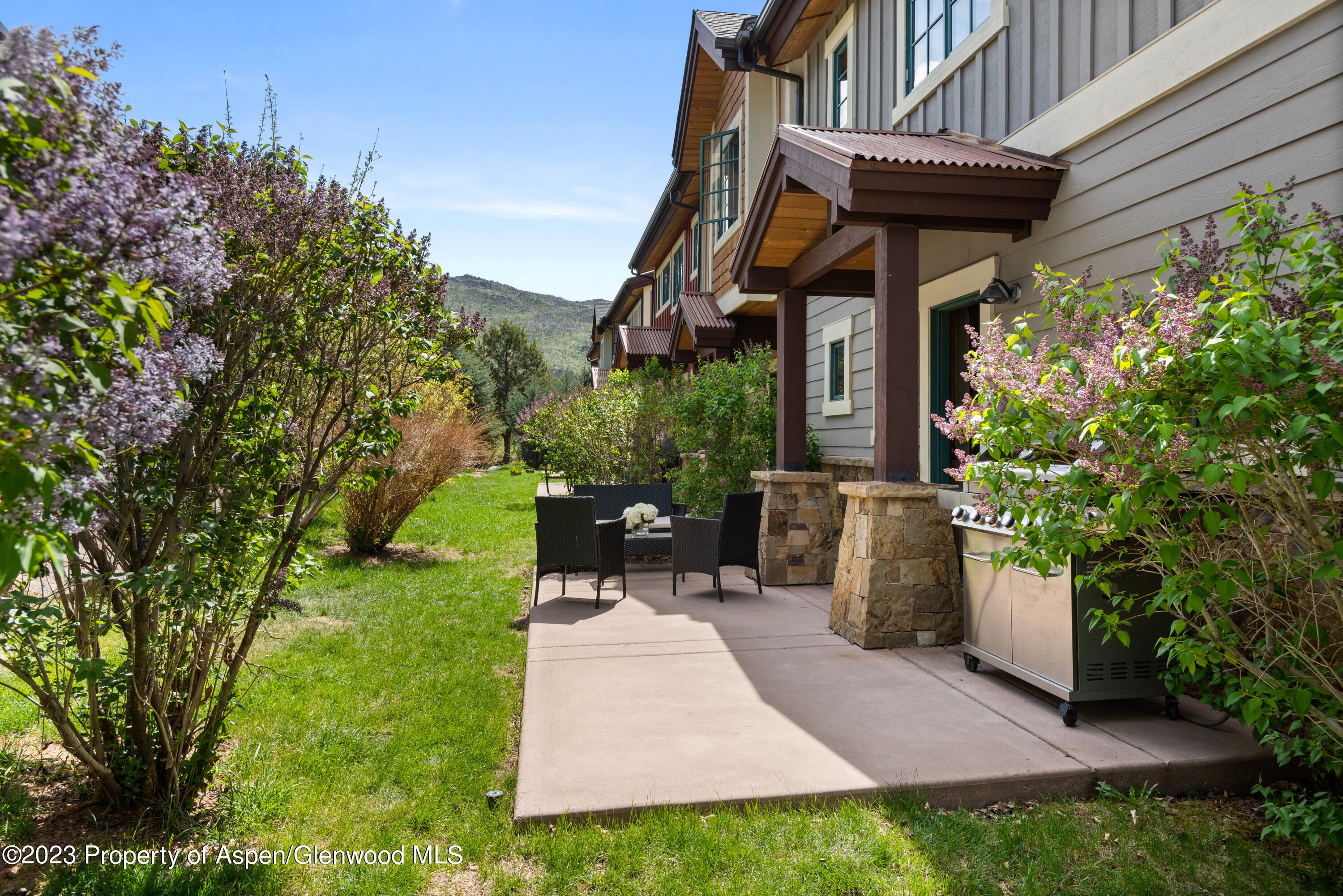 141 Juniper Trail Carbondale, CO 81623 - Photo 18 of 21 a view of a chairs and table in backyard of the house