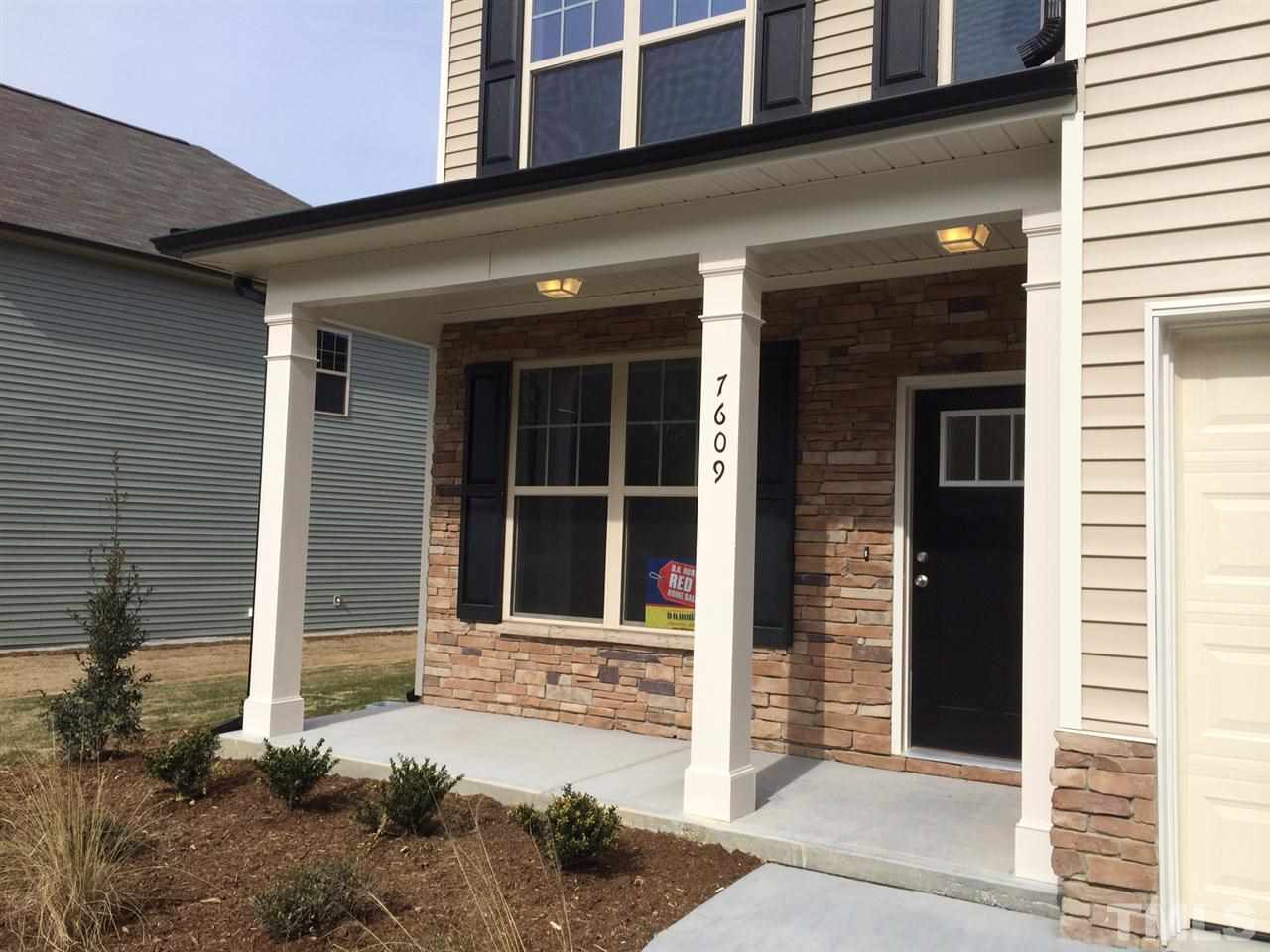 7609 Channery Way Raleigh, NC 27616 - Photo 2 of 25 a front view of a house with a yard