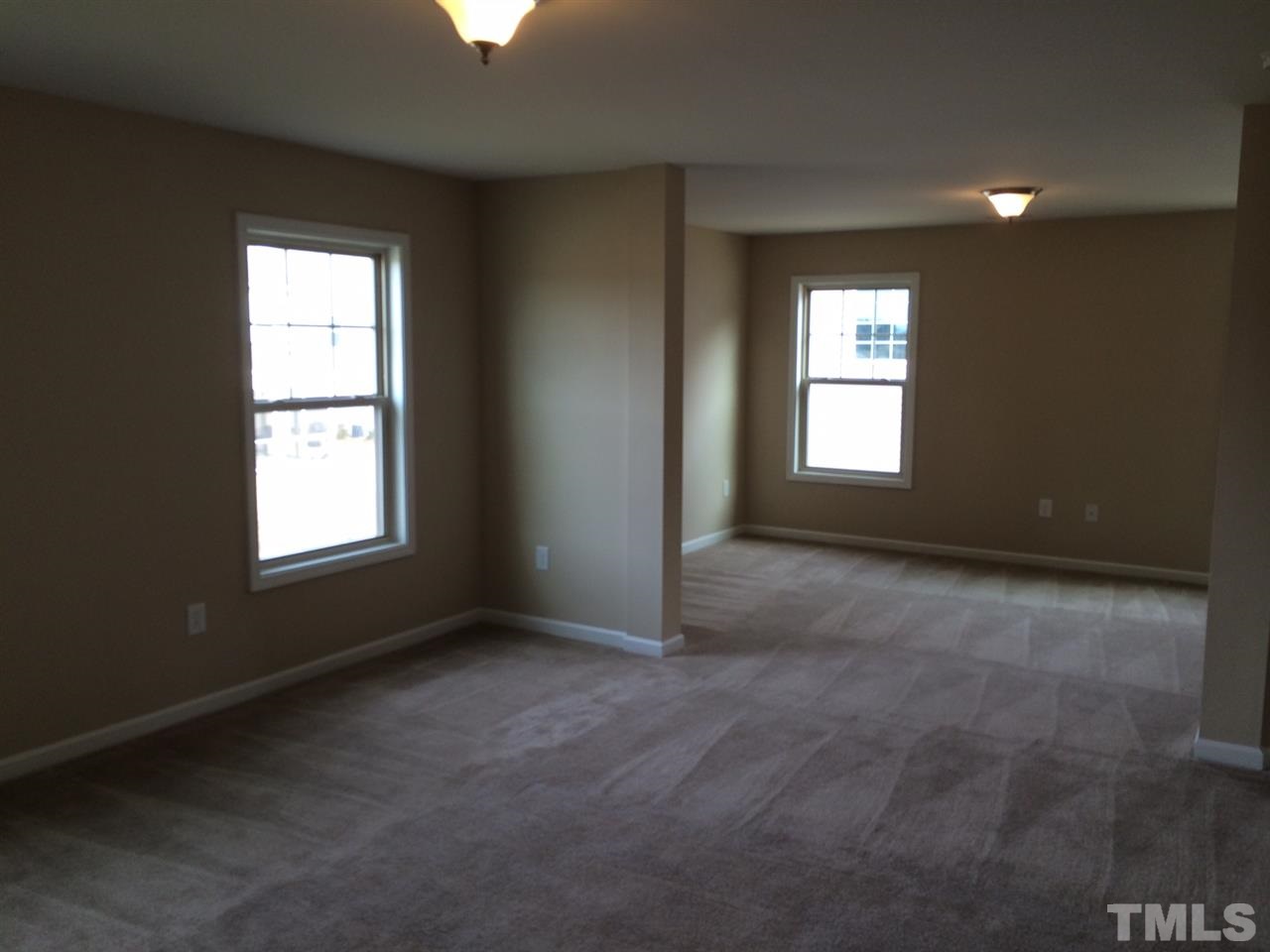 7609 Channery Way Raleigh, NC 27616 - Photo 12 of 25 a view of an empty room with a window