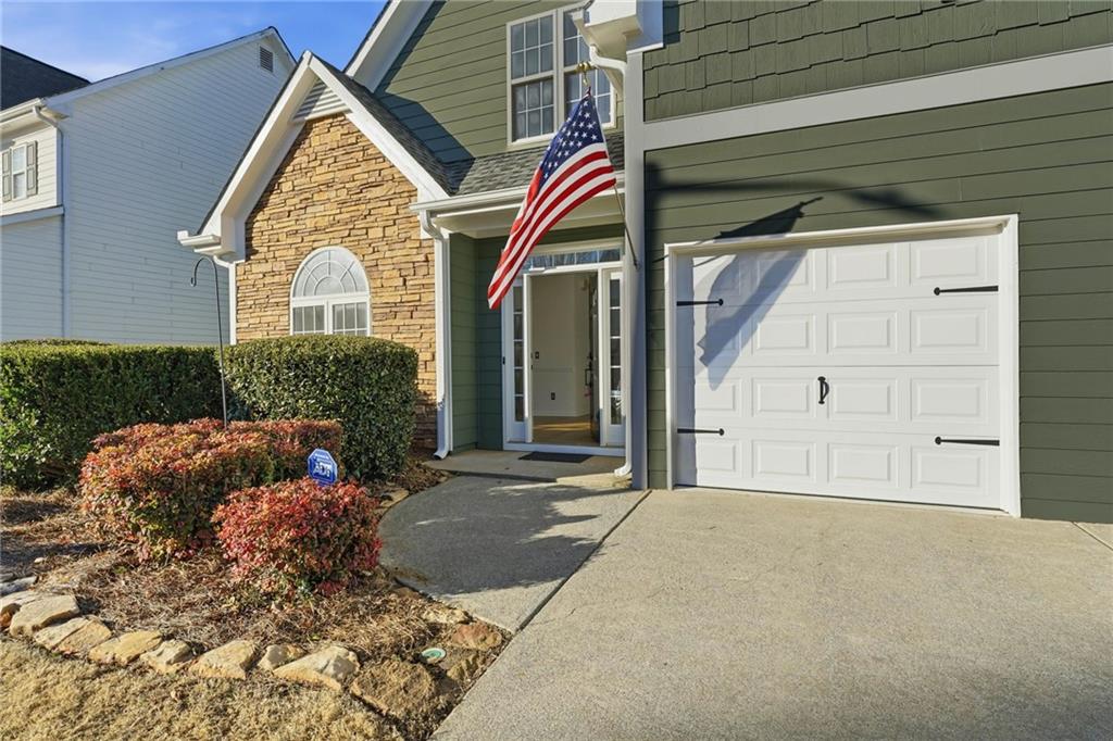 205 Towne Ridge Drive Woodstock, GA 30188 - Photo 11 of 56 a front view of a house with a yard