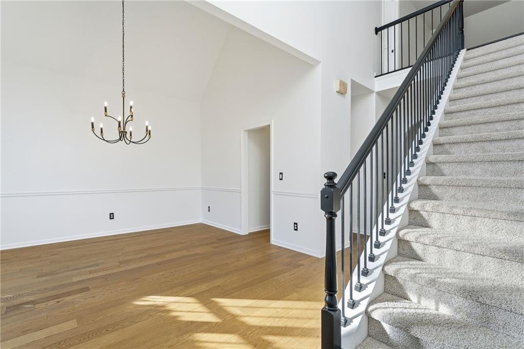 205 Towne Ridge Drive Woodstock, GA 30188 - Photo 13 of 56 a view of a room with wooden floor and white walls