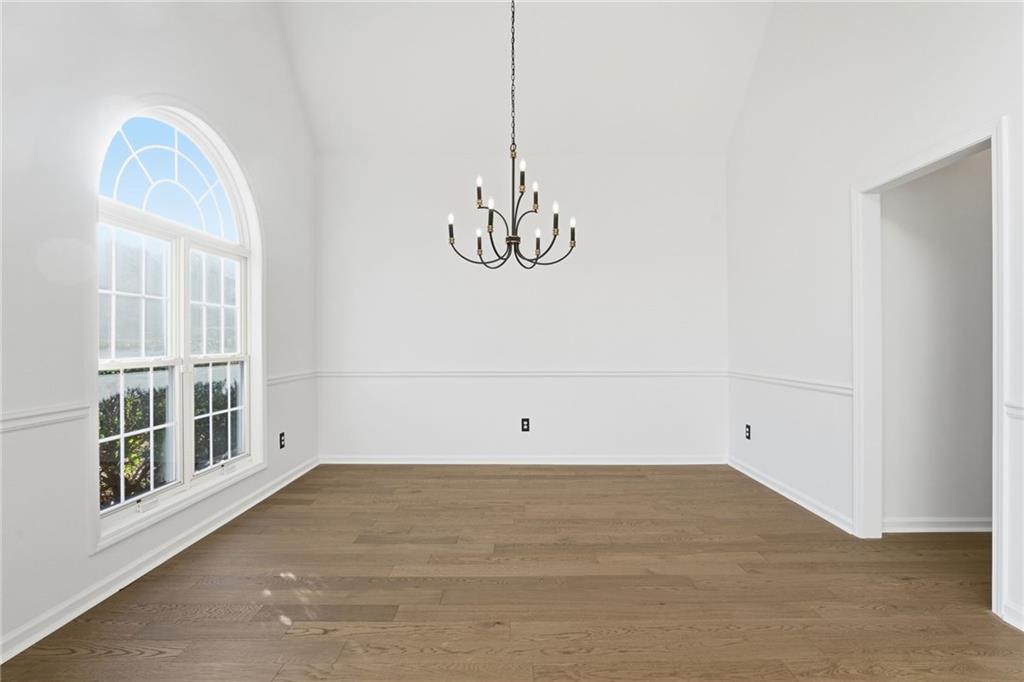 205 Towne Ridge Drive Woodstock, GA 30188 - Photo 14 of 56 a view of a room with wooden floor and windows