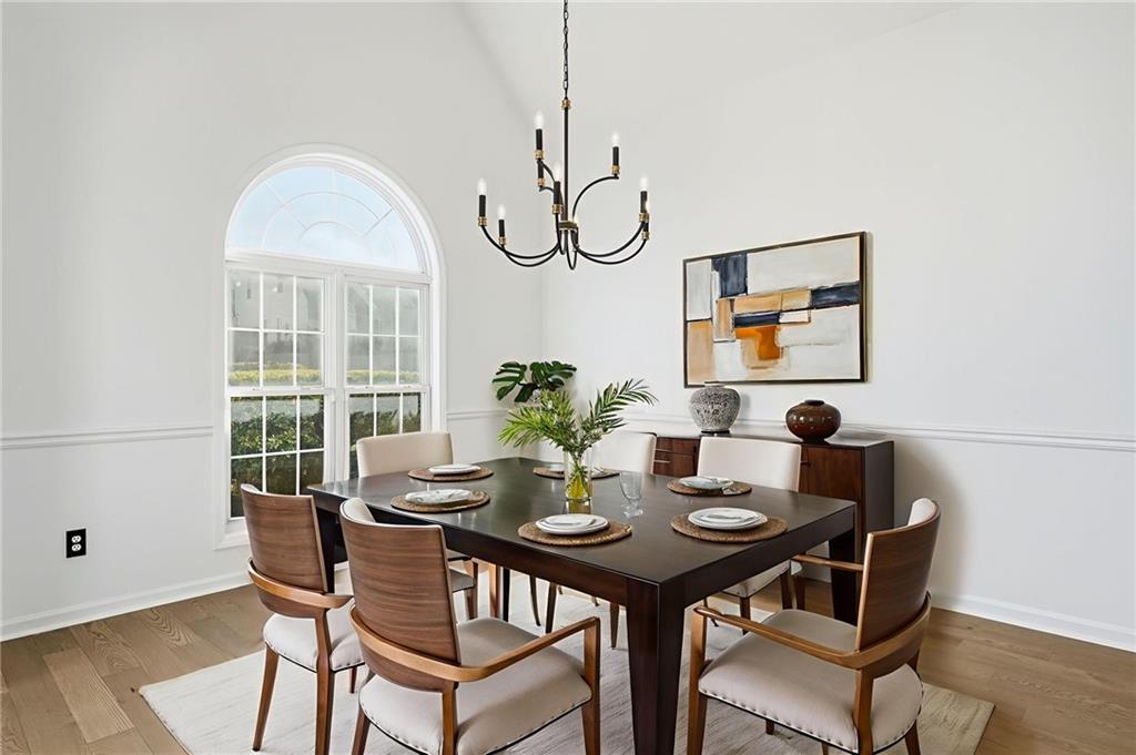 205 Towne Ridge Drive Woodstock, GA 30188 - Photo 16 of 56 a view of a dining room with furniture window and wooden floor