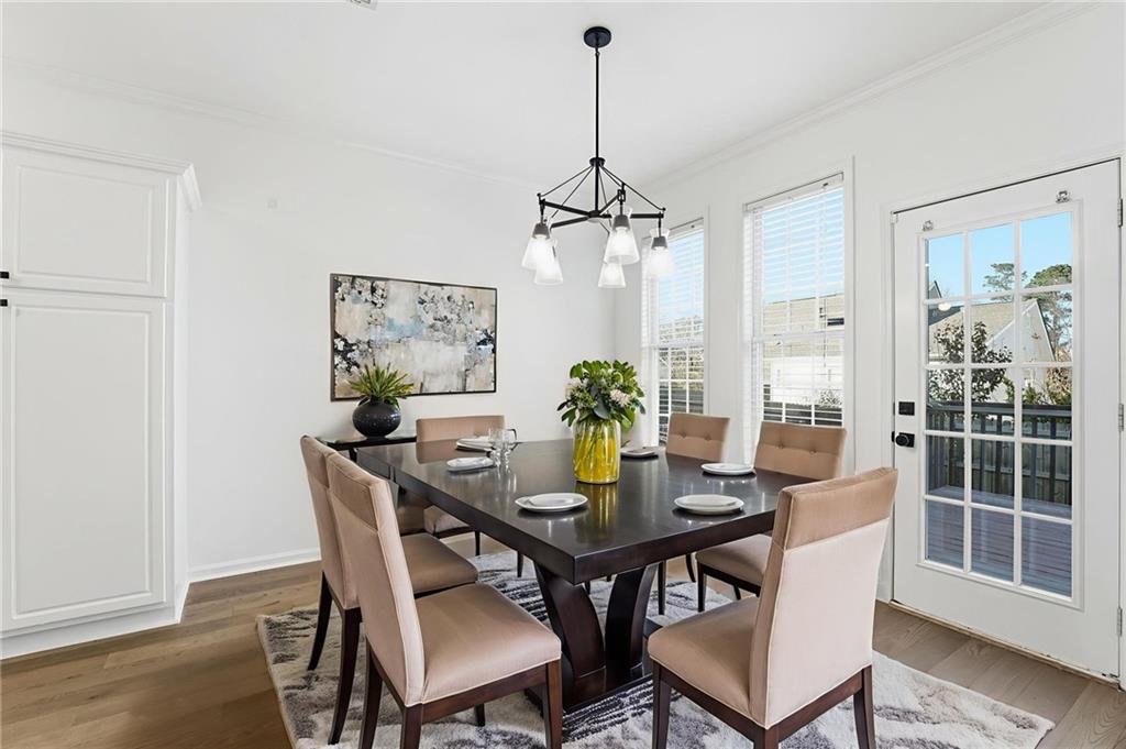205 Towne Ridge Drive Woodstock, GA 30188 - Photo 26 of 56 a view of a dining room with furniture window and wooden floor