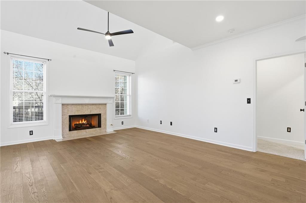 205 Towne Ridge Drive Woodstock, GA 30188 - Photo 28 of 56 a view of an empty room with a fireplace and a window