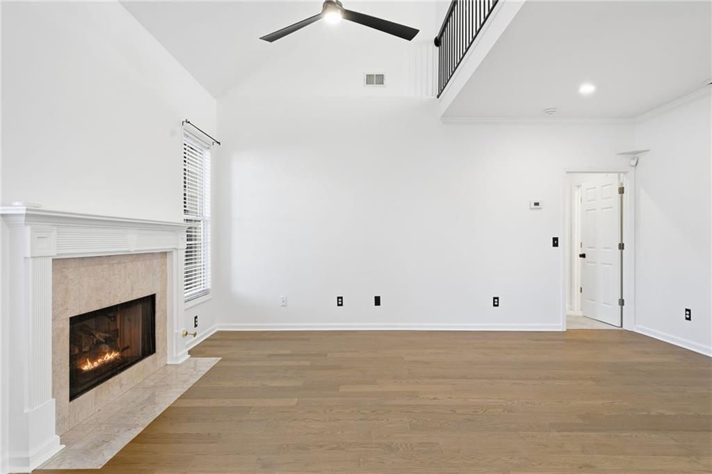 205 Towne Ridge Drive Woodstock, GA 30188 - Photo 31 of 56 a view of an empty room with a fireplace