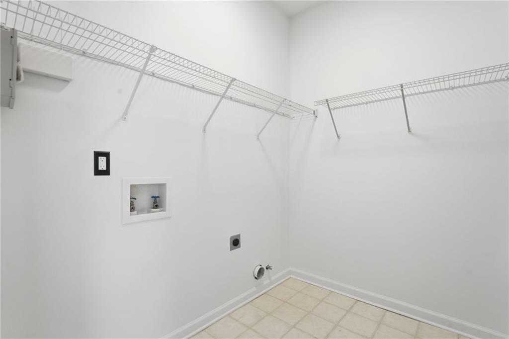 205 Towne Ridge Drive Woodstock, GA 30188 - Photo 39 of 56 a view of a room with racks on the wall