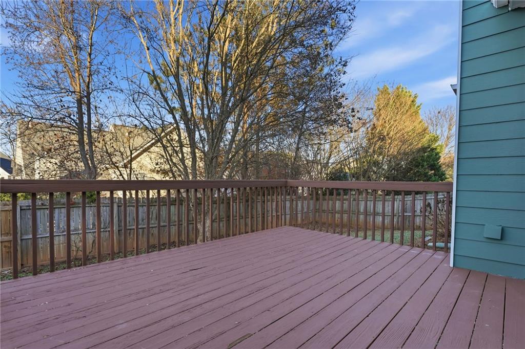 205 Towne Ridge Drive Woodstock, GA 30188 - Photo 49 of 56 a balcony with wooden floor and trees