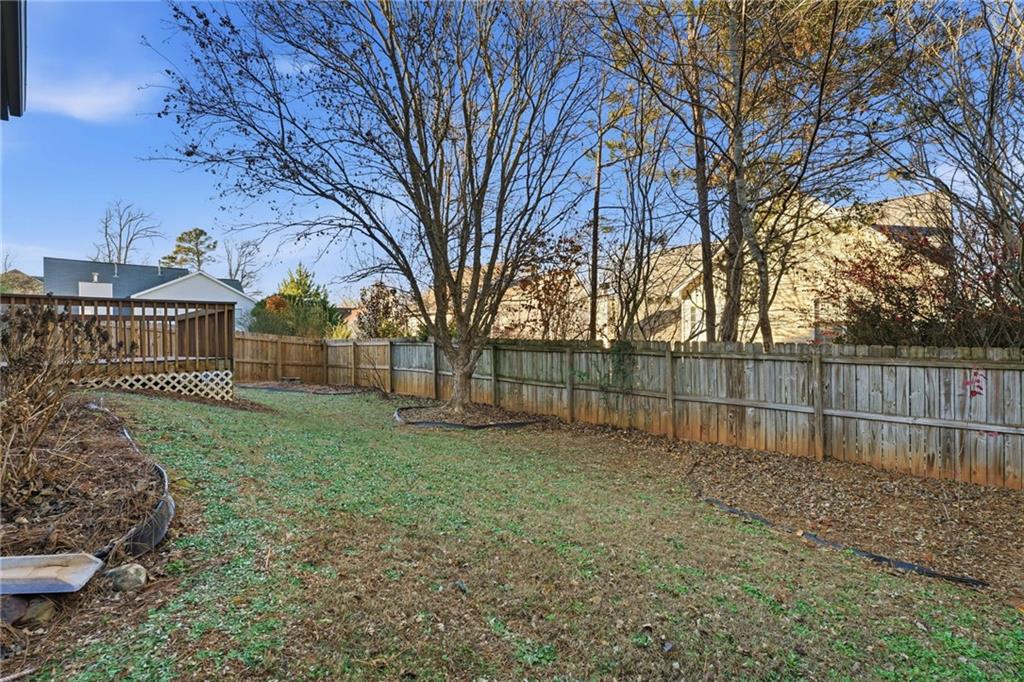 205 Towne Ridge Drive Woodstock, GA 30188 - Photo 51 of 56 a view of a backyard with large trees