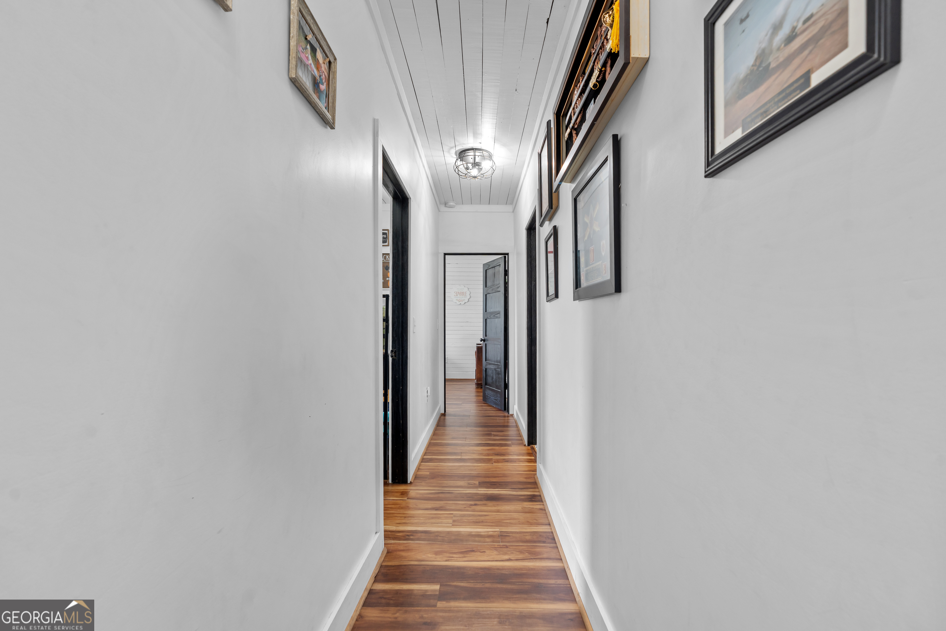 5065 10 Mile Road Baxley, GA 31513 - Photo 15 of 70 a view of a hallway with wooden floor and staircase