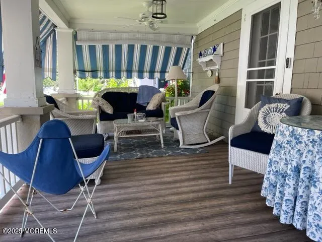 a living room with furniture a window and a fireplace
