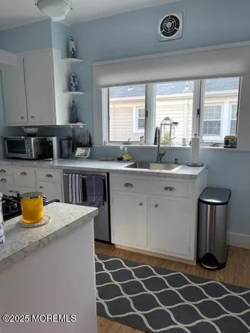a view of bathroom with washer and dryer