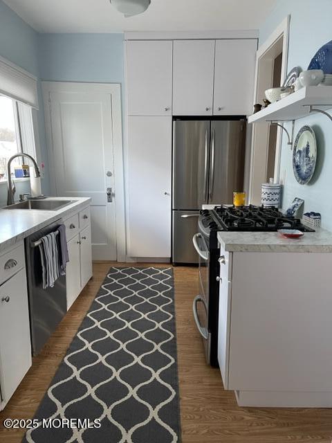 508 Passaic Avenue Spring Lake, NJ 07762 - Photo 7 of 18 a kitchen with a sink and a refrigerator