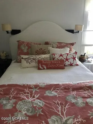 a bedroom with two beds and a walk in closet