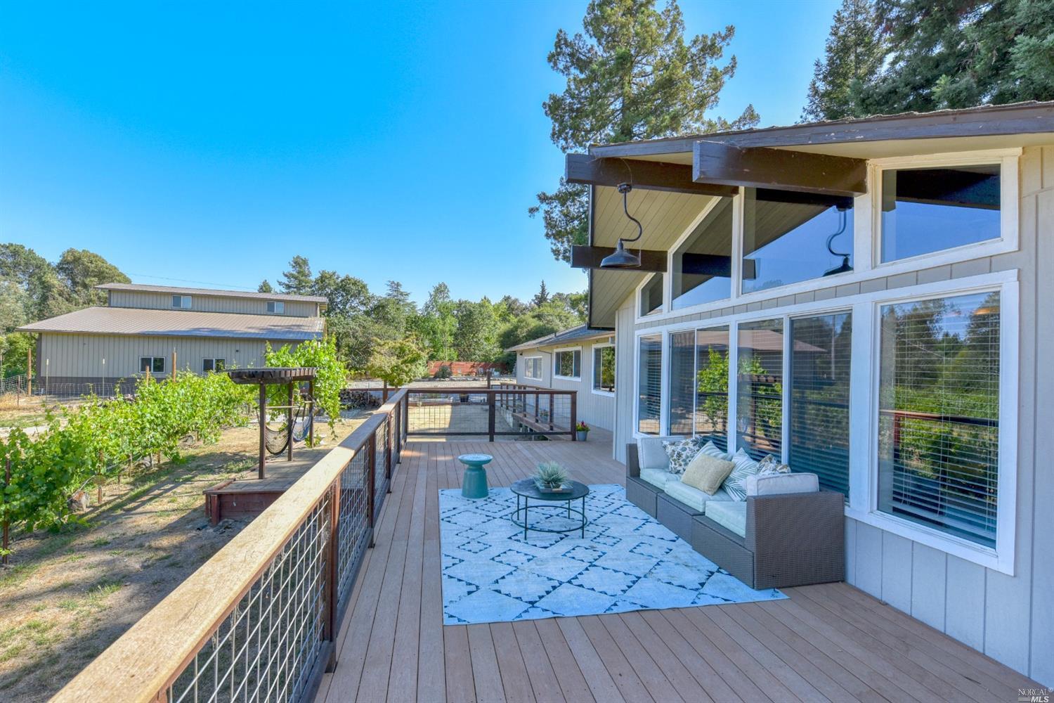 a view of a house with backyard and porch