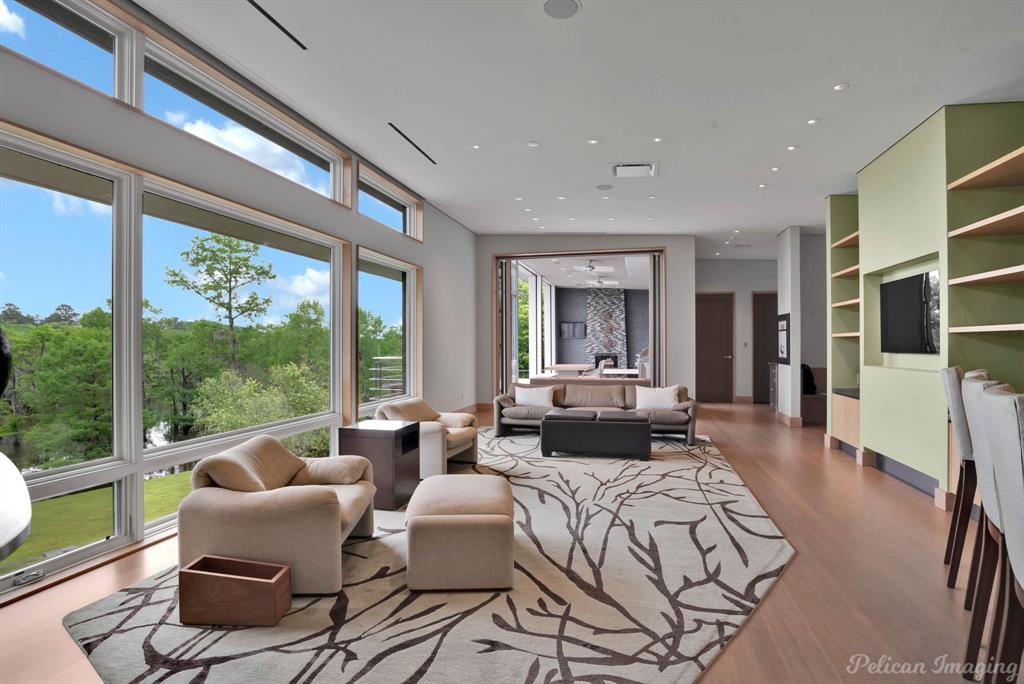 613 Moore Road Elm Grove, LA 71051 - Photo 14 of 40 Lovely den conveniently located next to the kitchen and offering access to the deck and outside cooking area