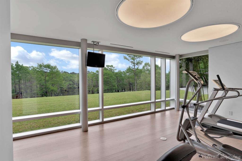 613 Moore Road Elm Grove, LA 71051 - Photo 25 of 40 a view of a room with gym equipment and windows