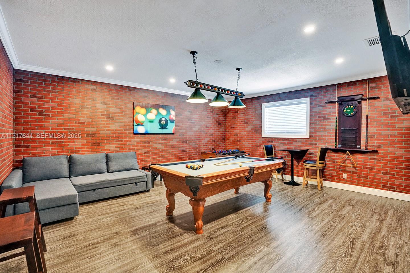 1301 Rodman Street Hollywood, FL 33019 - Photo 32 of 48 a living room with furniture a wooden floor and a window