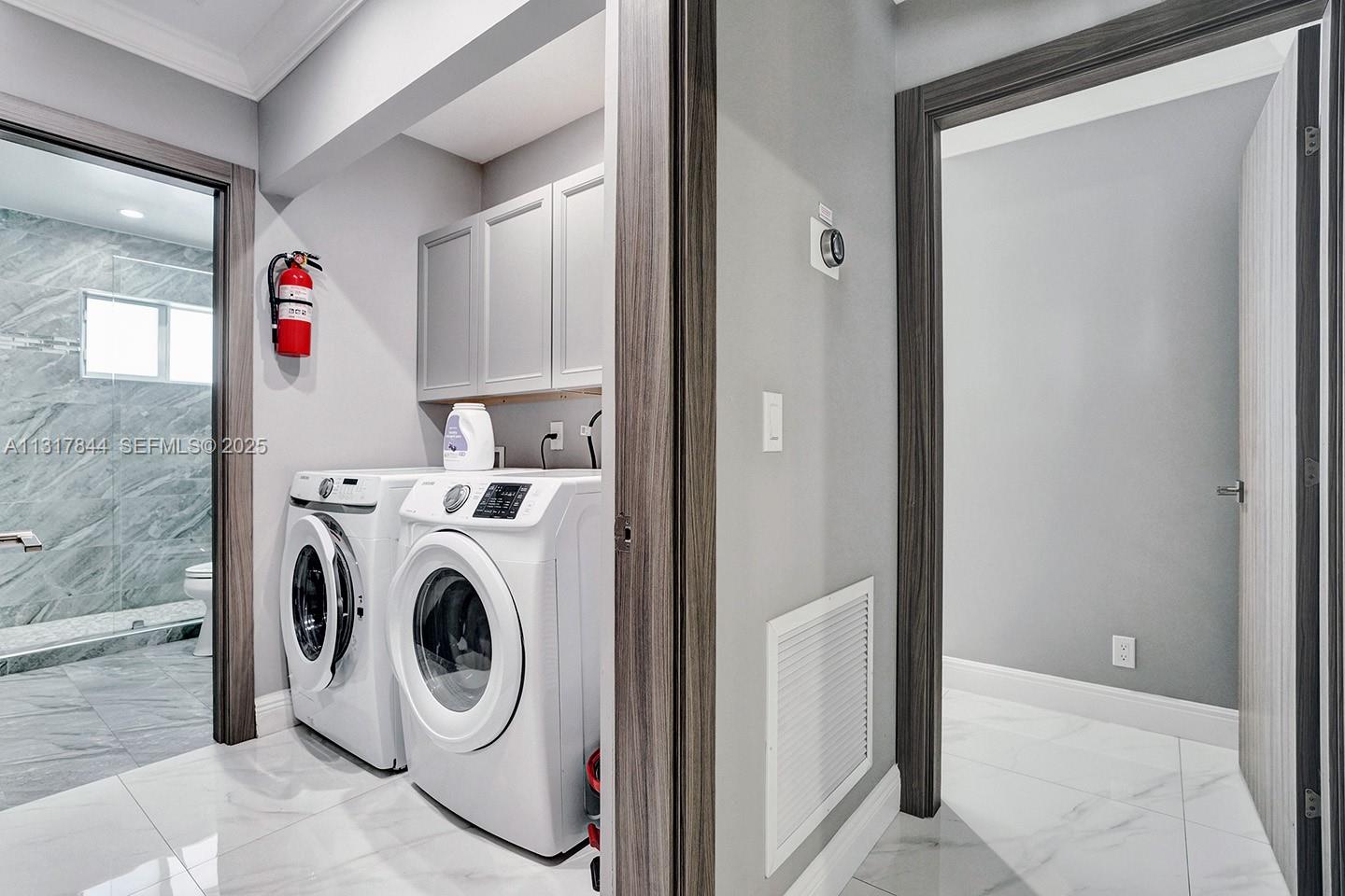1301 Rodman Street Hollywood, FL 33019 - Photo 34 of 48 a utility room with dryer and washer