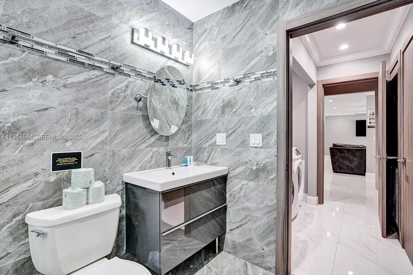 1301 Rodman Street Hollywood, FL 33019 - Photo 36 of 48 a bathroom with a sink toilet and shower