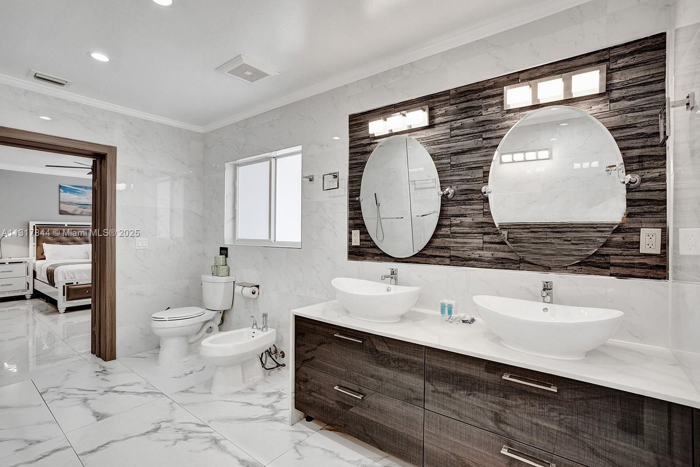 1301 Rodman Street Hollywood, FL 33019 - Photo 41 of 48 a bathroom with a double vanity sink mirror and toilet
