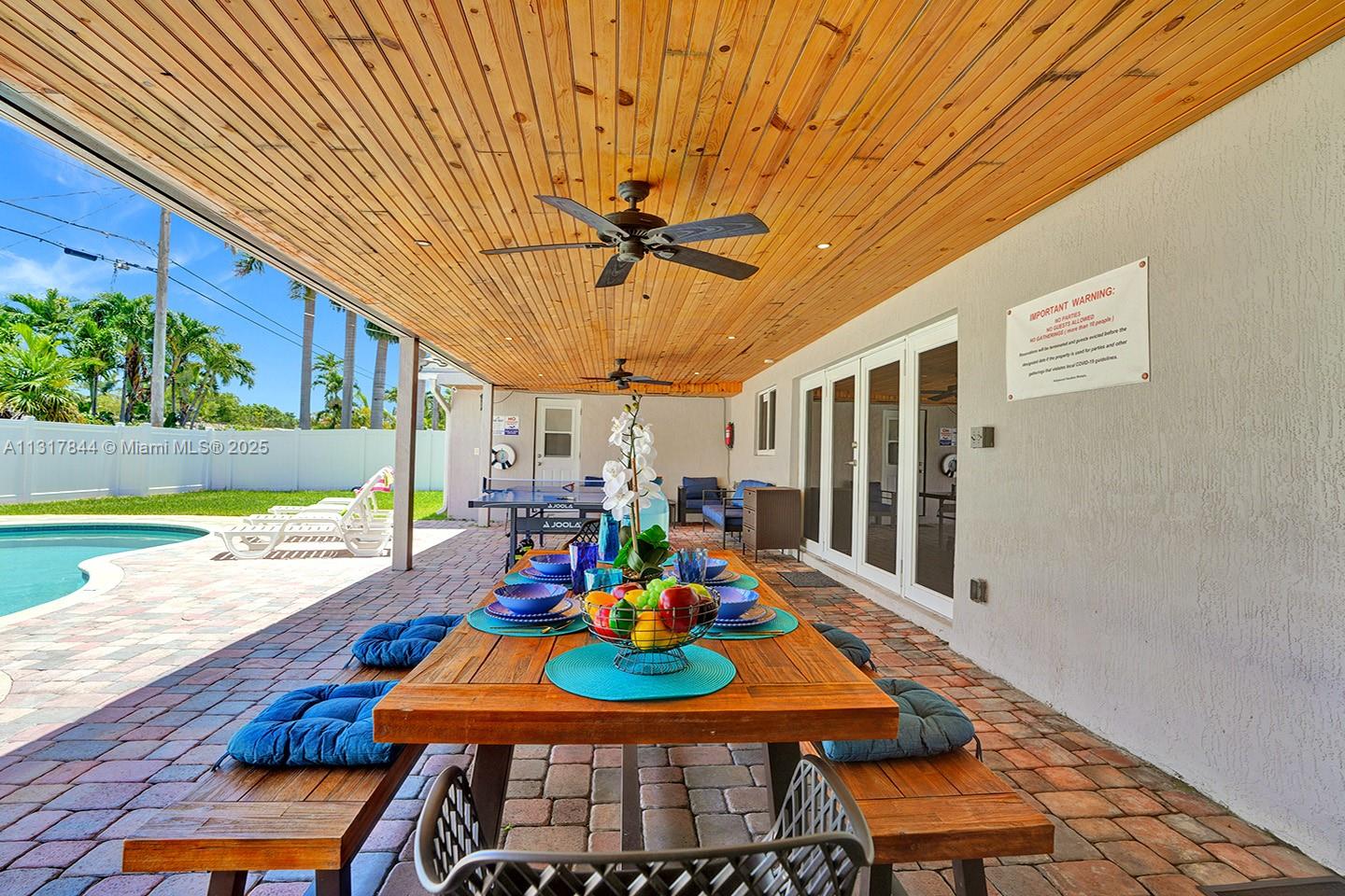 1301 Rodman Street Hollywood, FL 33019 - Photo 7 of 48 a view of a dining room with furniture and a potted plant