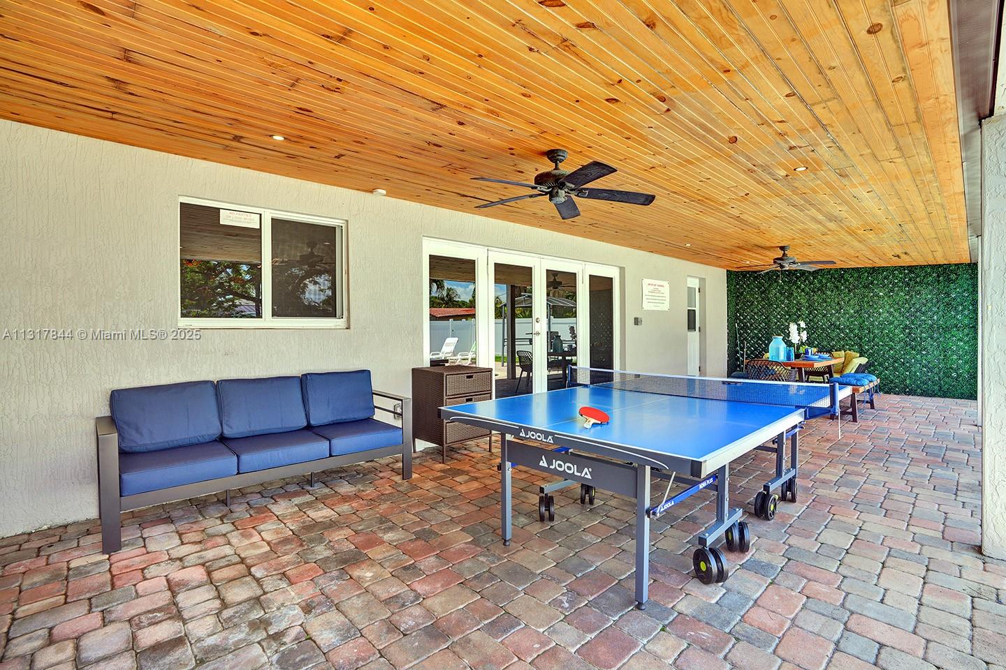 1301 Rodman Street Hollywood, FL 33019 - Photo 9 of 48 a view of a tables and chairs in patio