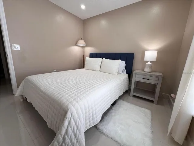 a bathroom with a toilet sink a mirror and shower