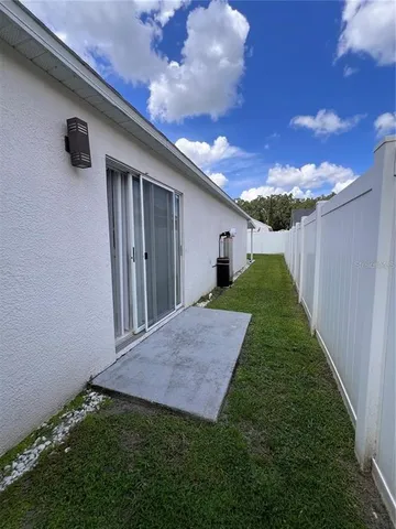 a view of a backyard with pathway