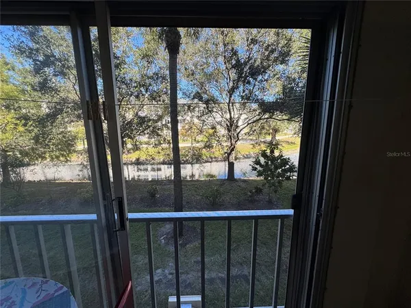 a view of a forest from a balcony
