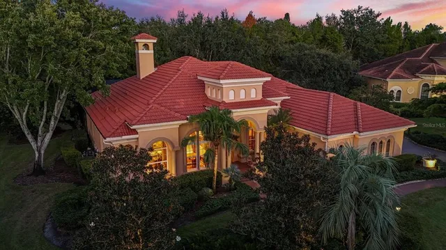 a view of a house with a yard next to a road