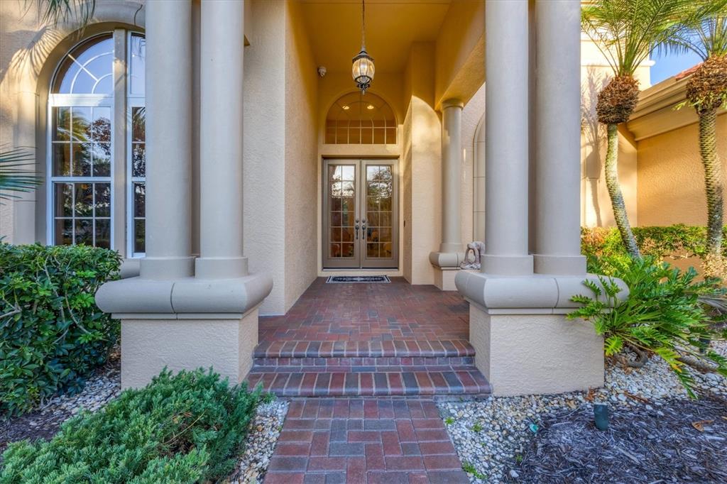 7815 Mathern Court Lakewood Ranch, FL 34202 - Photo 12 of 55 a front view of a house with a garden