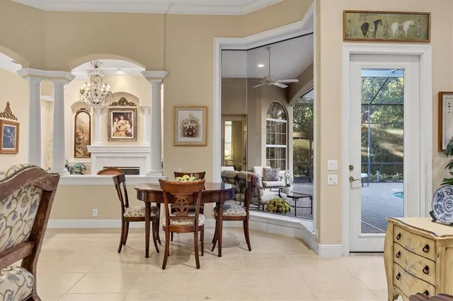 a view of a dining room with furniture and chandelier