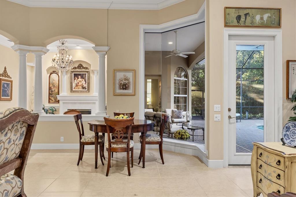 7815 Mathern Court Lakewood Ranch, FL 34202 - Photo 21 of 55 a view of a dining room with furniture and chandelier