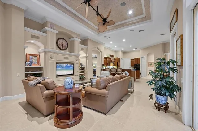 a living room with furniture potted plant and a fireplace
