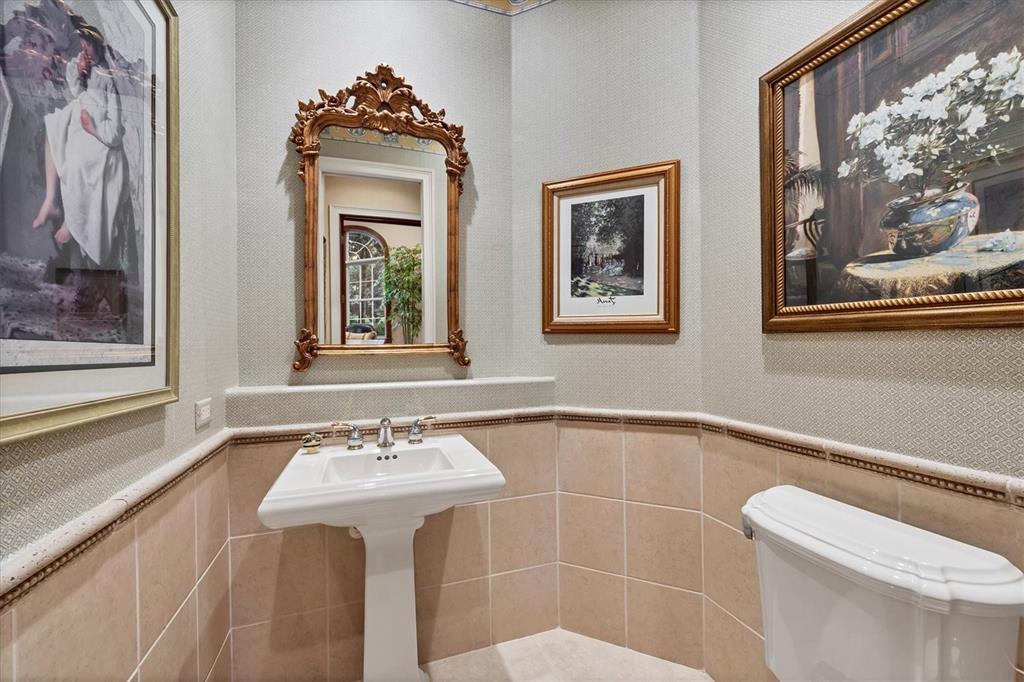 7815 Mathern Court Lakewood Ranch, FL 34202 - Photo 26 of 55 a bathroom with a sink mirror and toilet