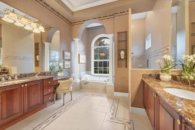 a bedroom with a bed and a lamp on table