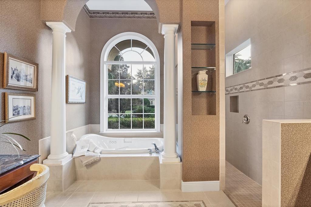 7815 Mathern Court Lakewood Ranch, FL 34202 - Photo 32 of 55 a living room with a bath tub and a large window