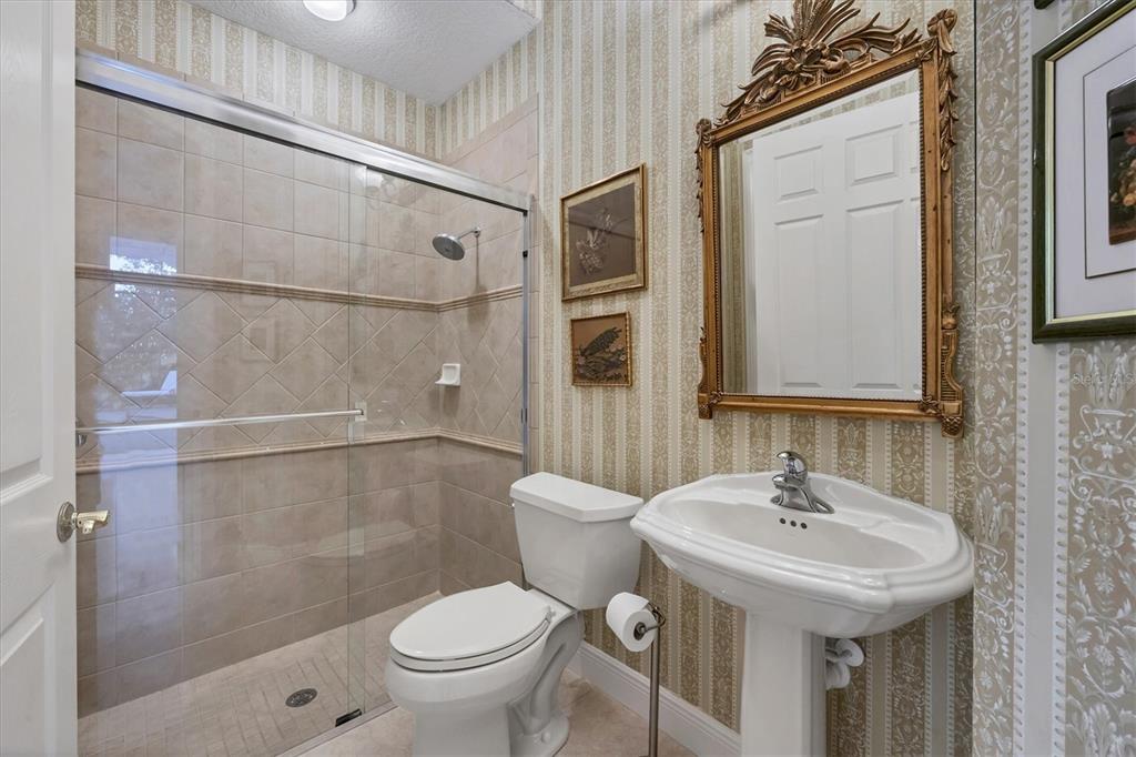 7815 Mathern Court Lakewood Ranch, FL 34202 - Photo 34 of 55 a bathroom with a sink a toilet and shower